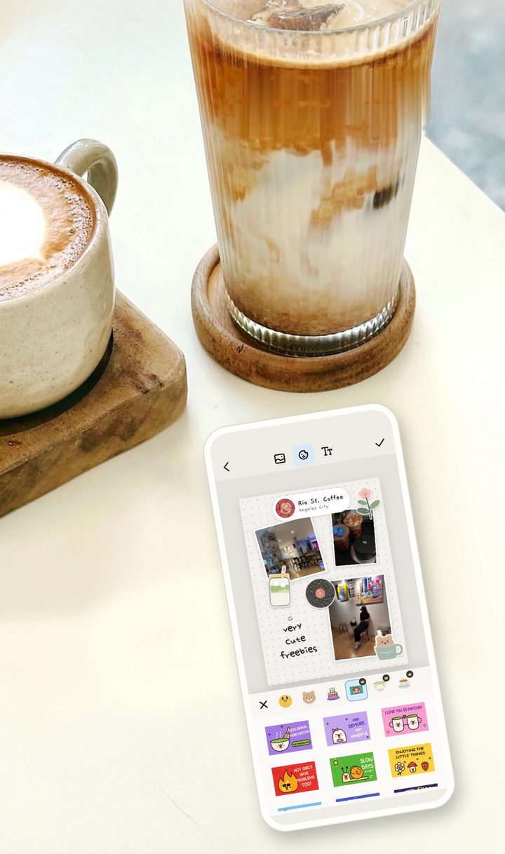 Cafe Journal open on a phone next to an iced latte and a hot latte on a cafe table